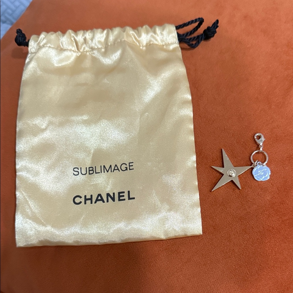 CHANEL Holiday 2025 Camellia Star Comet Charm Keychain  Gold Silver Pouch